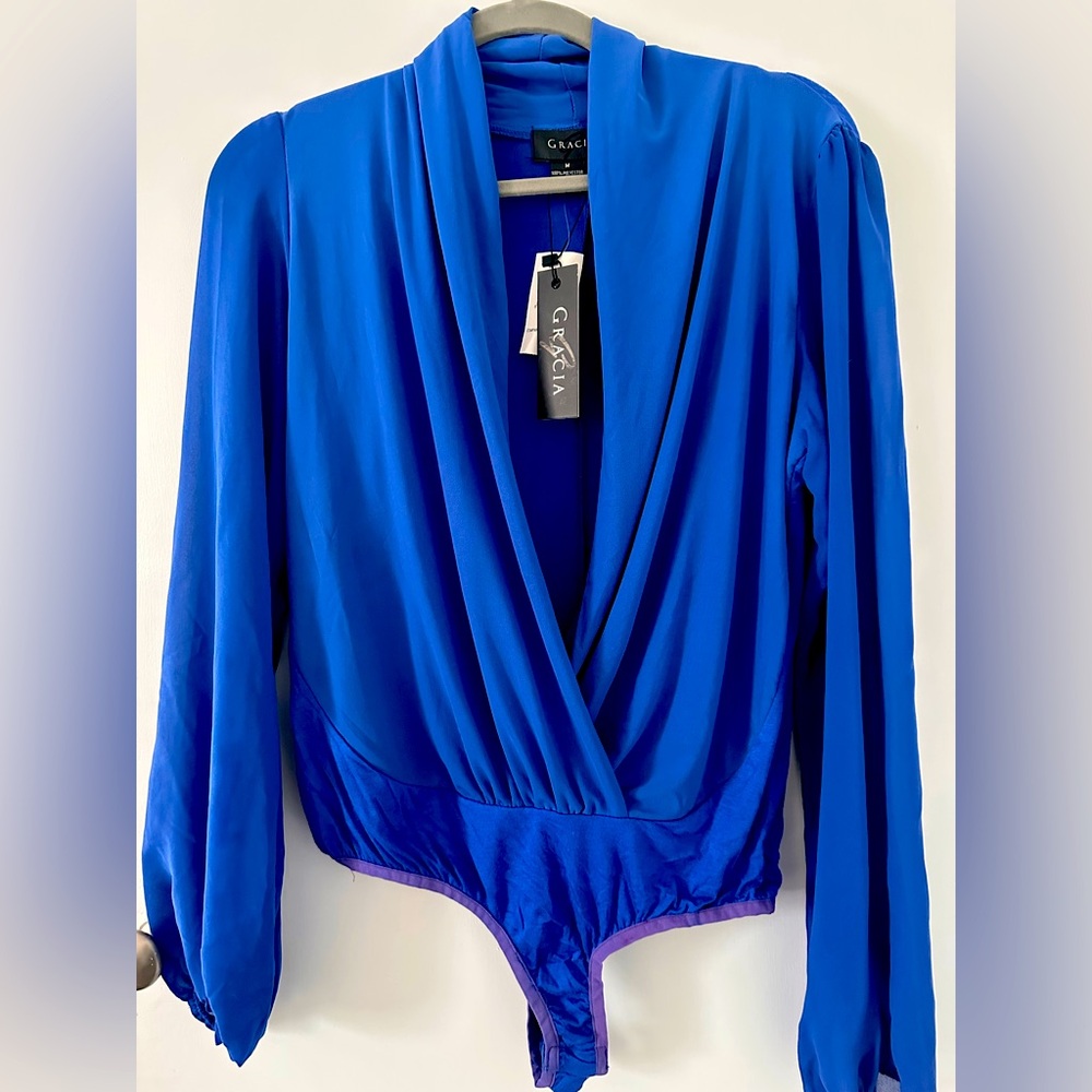 Royal blue bodysuit with long sleeves.